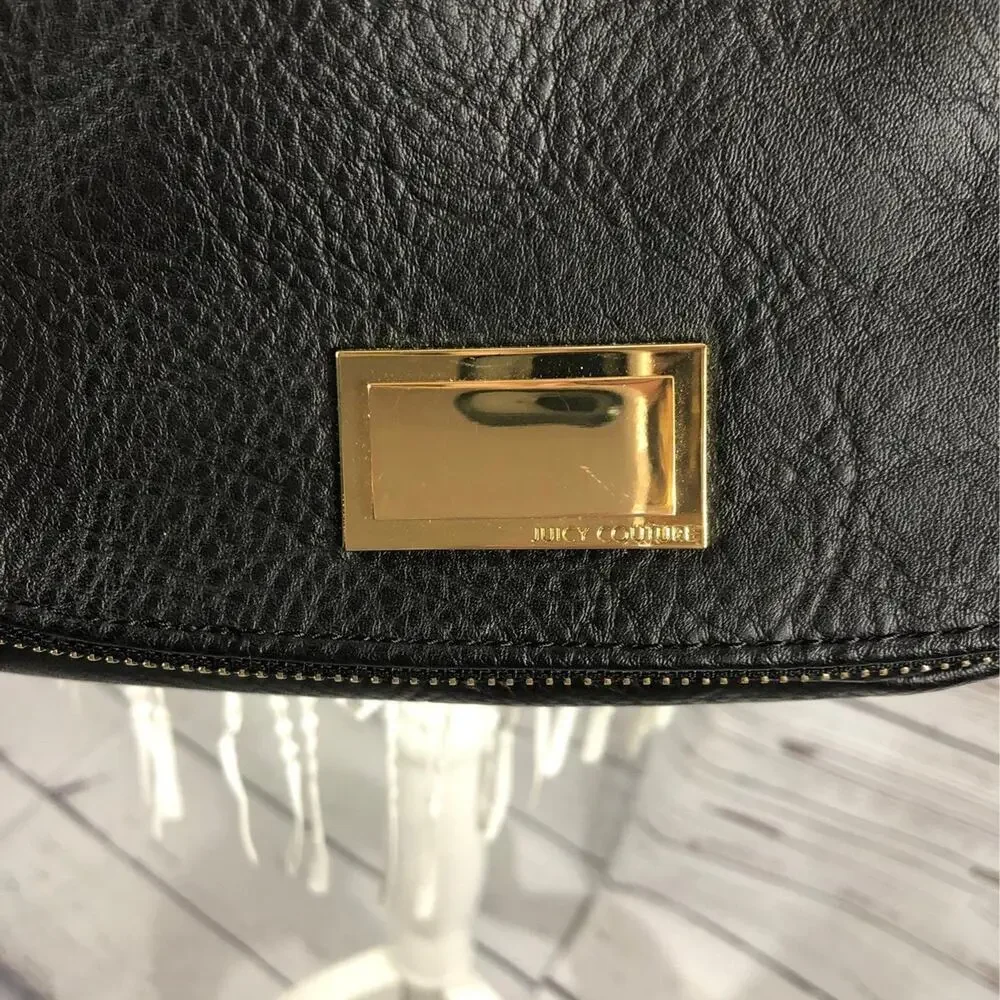 Juicy Couture shoulder crossbody bag in black with Gold embellishments.